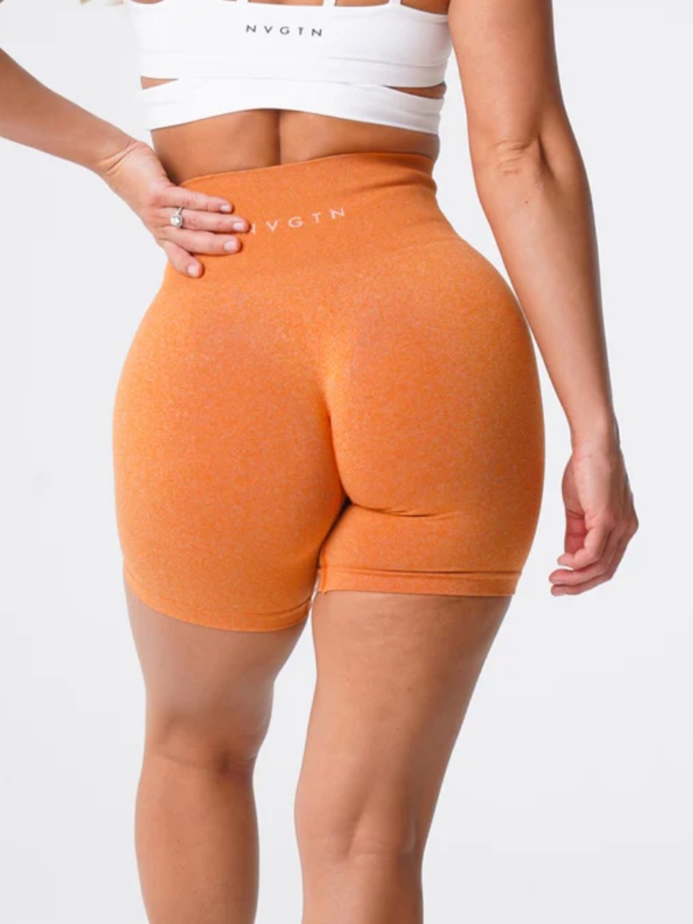 NVGTN orange seamless workout shorts